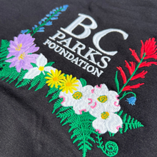 Load image into Gallery viewer, A detailed image of the embroidery on a BC parks Foundation Wildflower Hoodie Merch 