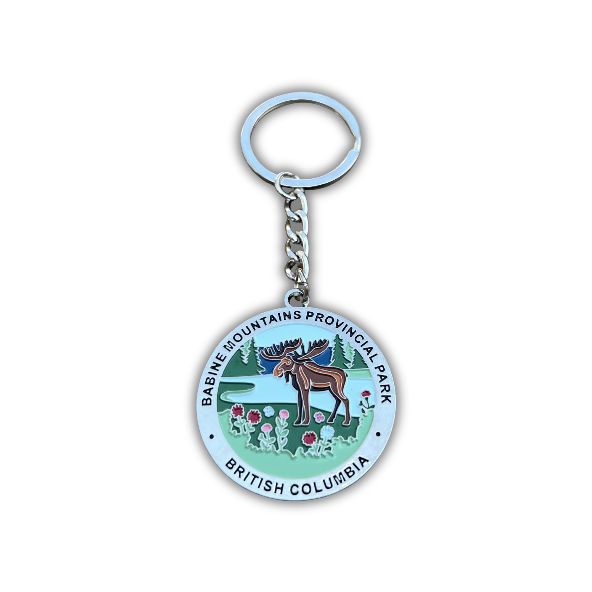 A round metal keychain featuring the official seal of Basin Fountains Provincial Park in British Columbia, Canada. The keychain has a silver-tone split ring and chain, with the circular pendant displaying the park's landscape, moose, and text.