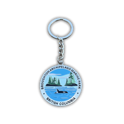 A round metal keychain featuring the Broughton Archipelago Marine Park seal from British Columbia, with a silver split ring and chain on a white background.