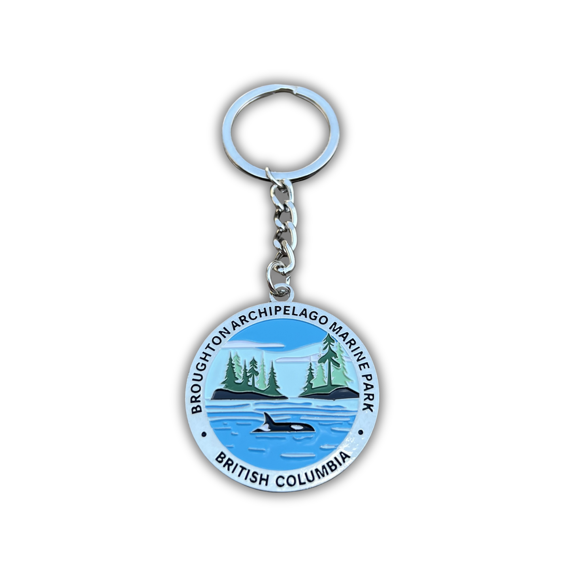 A round metal keychain featuring the Broughton Archipelago Marine Park seal from British Columbia, with a silver split ring and chain on a white background.