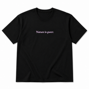 A black short-sleeve crewneck t-shirt with the phrase 'Nature is queer.' printed in a light pink serif font across the chest, displayed on a clean white background.