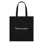 A black canvas tote bag with two black shoulder straps and the phrase 'Nature is queer.' printed in white serif text across the center, shown against a plain white background.