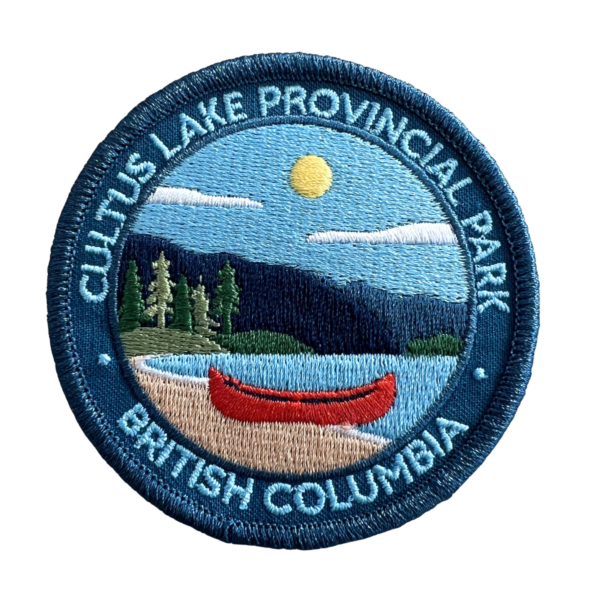 An embroidered oval patch for Cultus Lake Provincial Park in British Columbia, featuring a blue border with white text and a central landscape scene with a red canoe, blue sky, yellow sun, trees, and water.